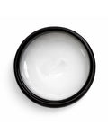 Black container of white OWAY boho pomade for hair on a white background