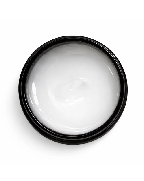 Black container of white OWAY boho pomade for hair on a white background