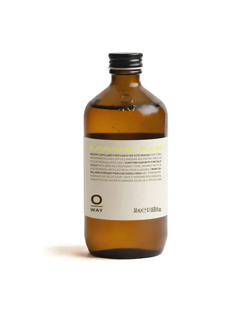 Brown bottle of OWAY purifying hair bath for oily scalp on a white background