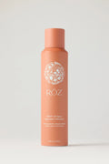 Orange ROZ root lift spray bottle on a light grey background