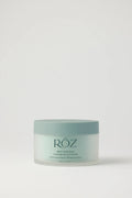 Green container of ROZ Salt Scrub on white background